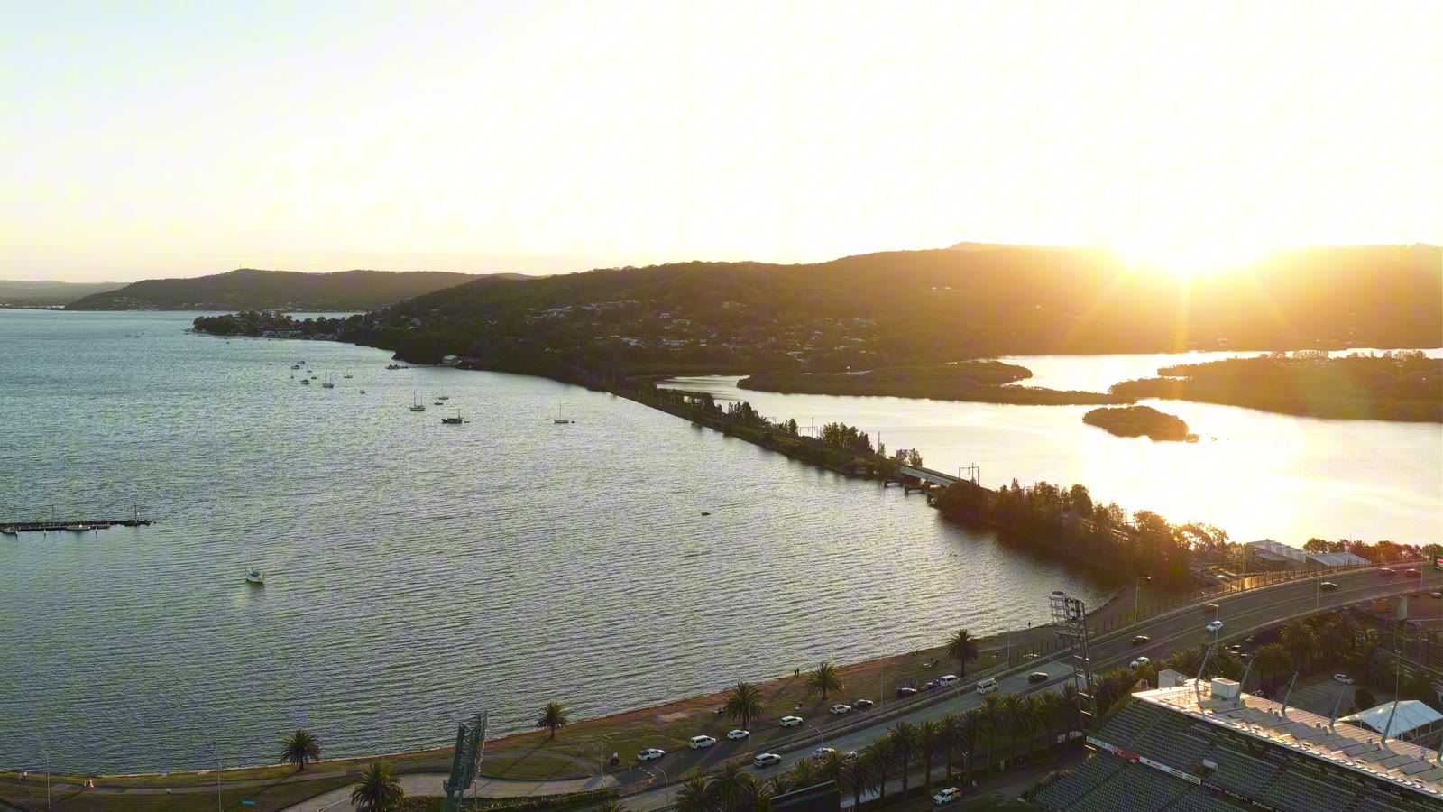 Aerial view across waterfront buildings and parkland